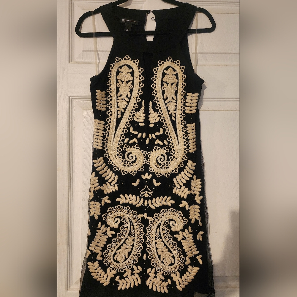 INC women's embroidered ivory & rhinestone detail over a  black sheer layer.